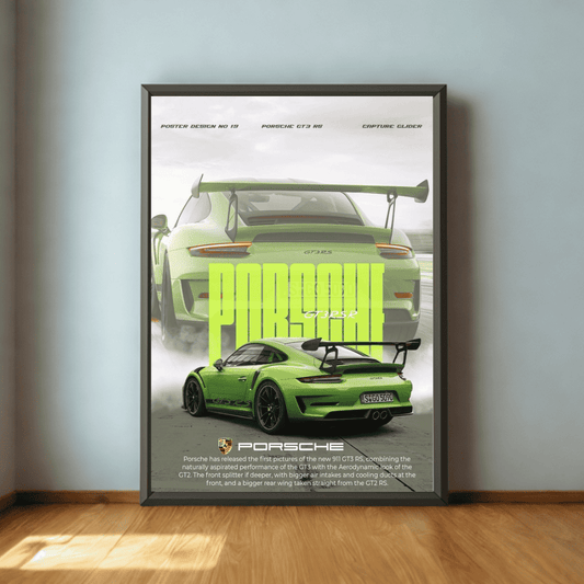 Framed poster of a green Porsche car on a wall.